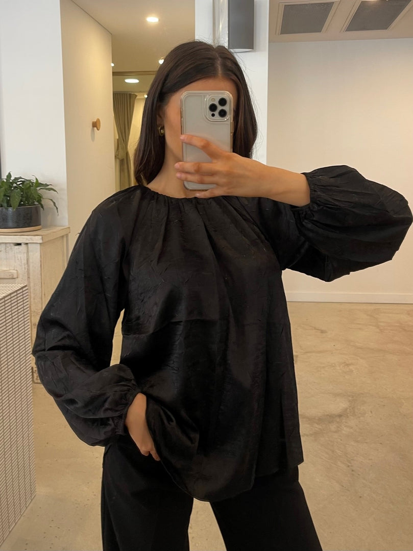 IN MOTION TOP