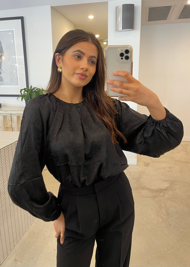 IN MOTION TOP